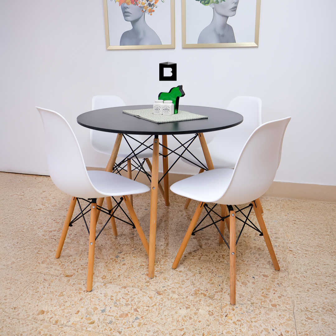 COMEDOR REDONDO TAPA NEGRA MÁS 4 SILLAS DKR TIPO EAMES BLANCAS